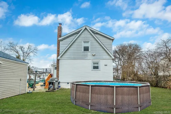 a view of backyard with sitting area