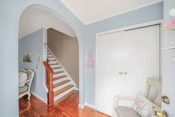 a white toilet sitting next to a shower curtain