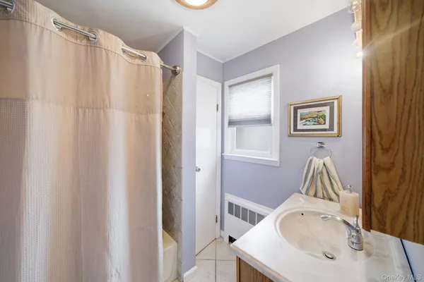 a bathroom with a sink a mirror and a bathtub
