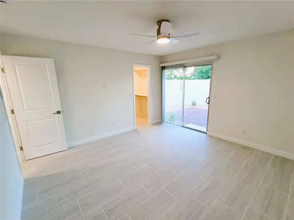 a view of an empty room with a window