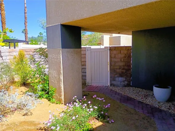 a view of house with backyard