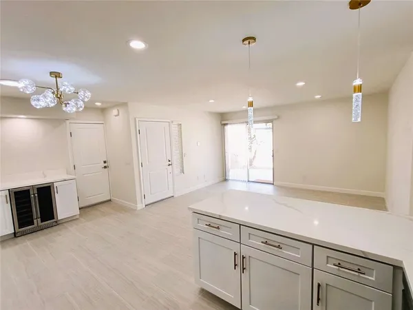 a view of a kitchen with marble kitchen and sink