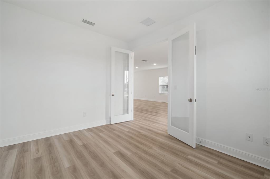 10705 Wading River Avenue Parrish, FL 34219 - Photo 13 of 28 a view of a bathroom with wooden floor