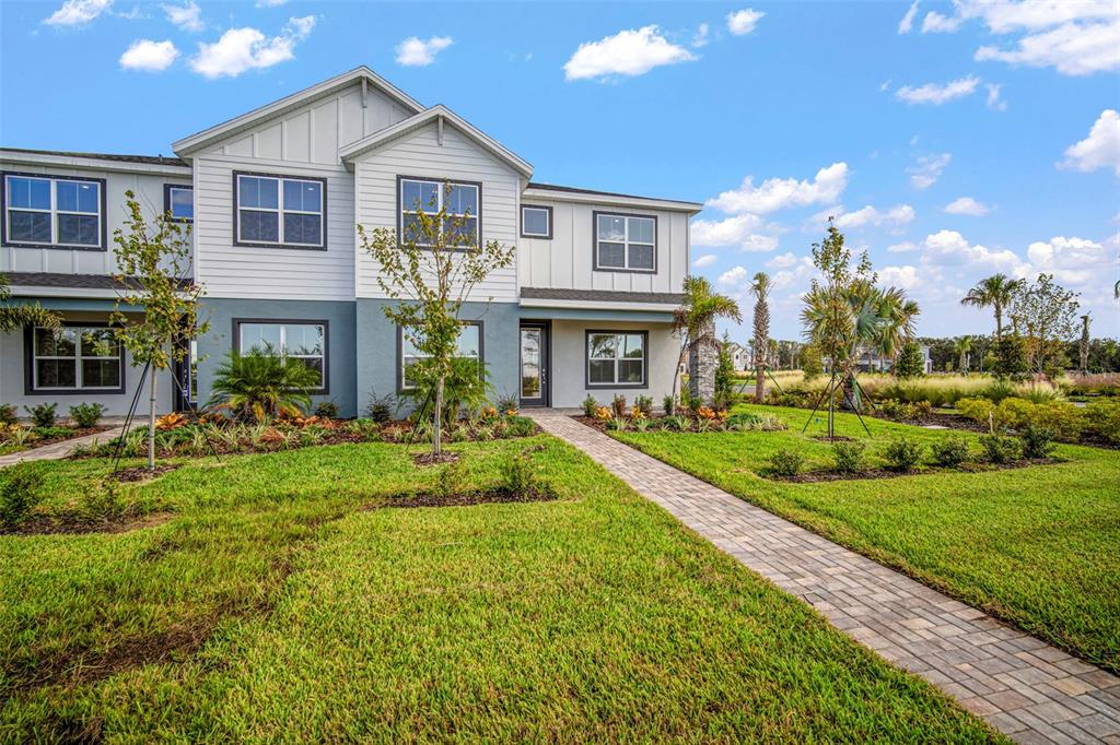 10705 Wading River Avenue Parrish, FL 34219 - Photo 2 of 28 a front view of a house with a yard
