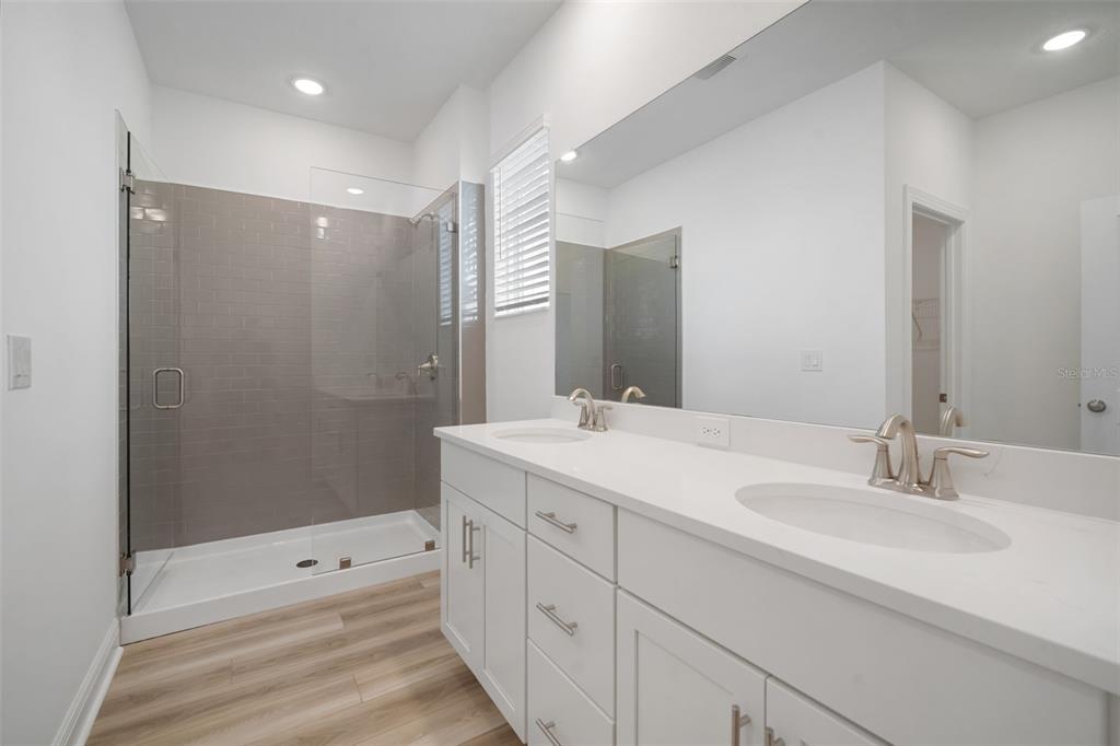 10705 Wading River Avenue Parrish, FL 34219 - Photo 21 of 28 a bathroom with double sink and mirror