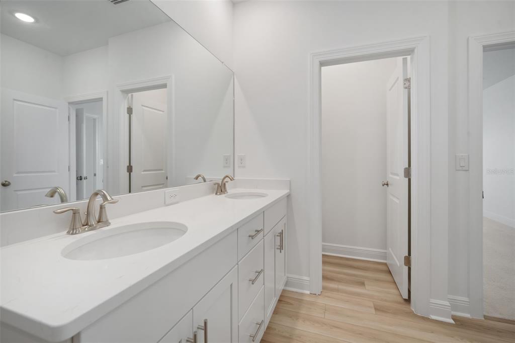 10705 Wading River Avenue Parrish, FL 34219 - Photo 22 of 28 a bathroom with a sink and a mirror