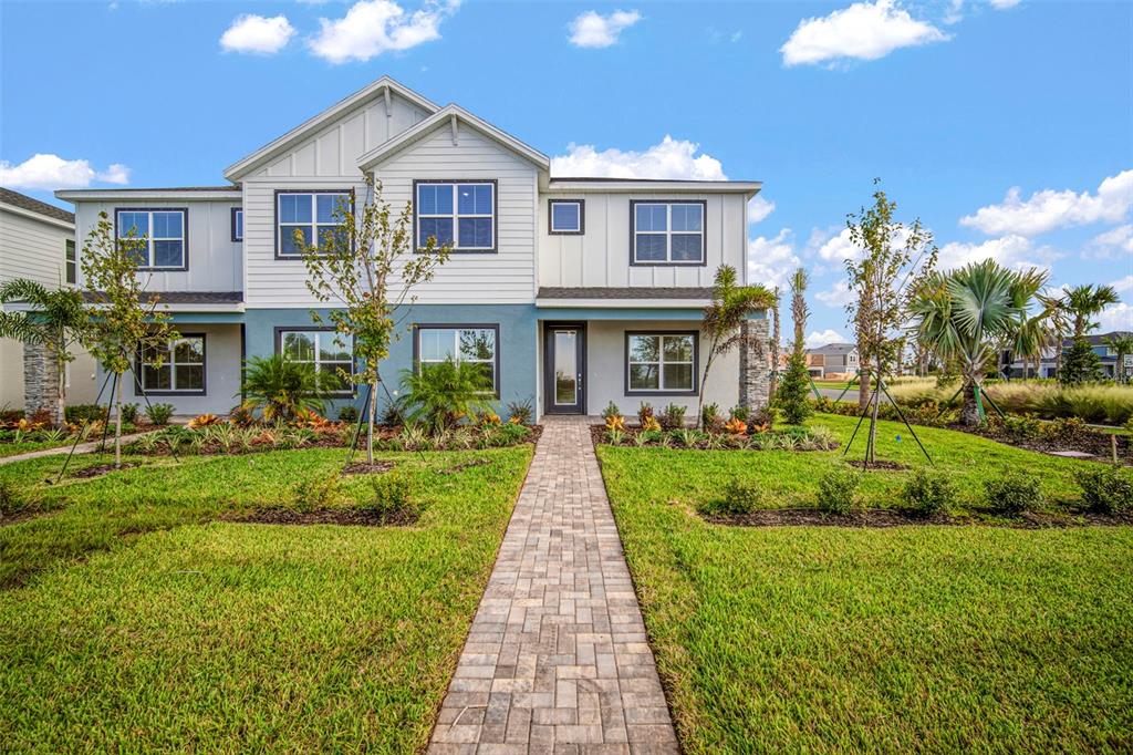 10705 Wading River Avenue Parrish, FL 34219 - Photo 3 of 28 a front view of a house with a yard