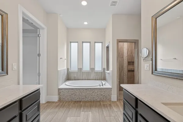 an empty room with a ceiling fan and carpet