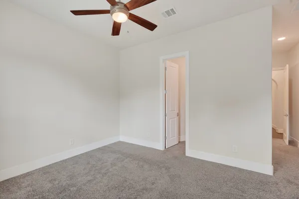 a view of a hallway with a chandelier