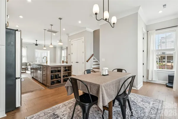 a view of a dining room with furniture window and wooden floor