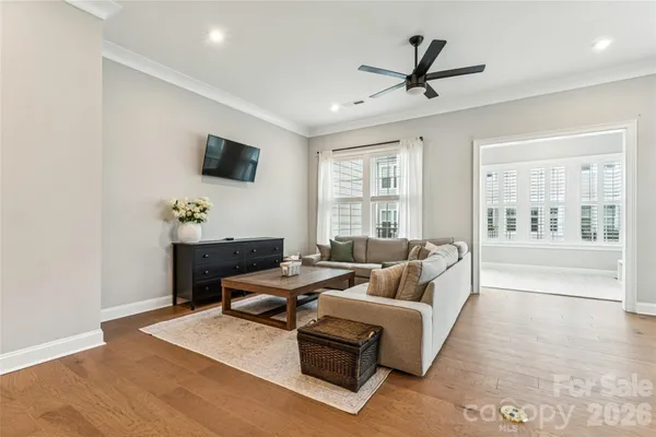 a living room with furniture and windows