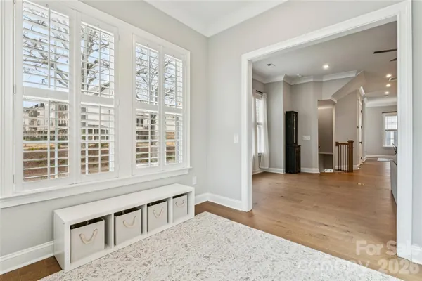 a view of a porch with wooden floor
