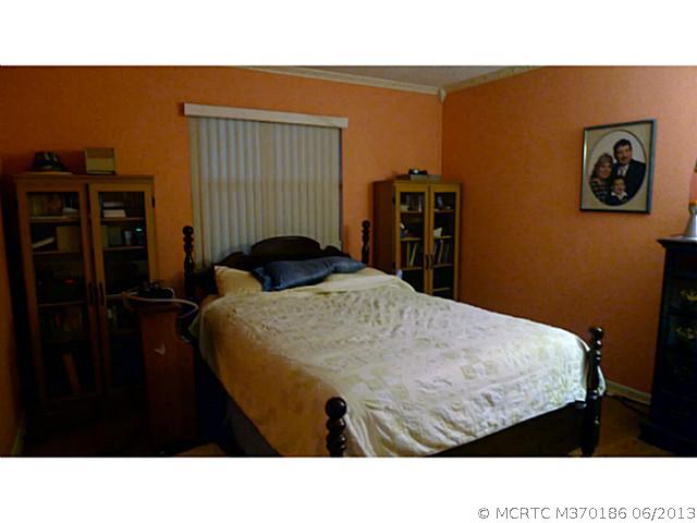 6715 Southeast Raintree Avenue Stuart, FL 34997 - Photo 5 of 12 Master Bedroom. Split Plan