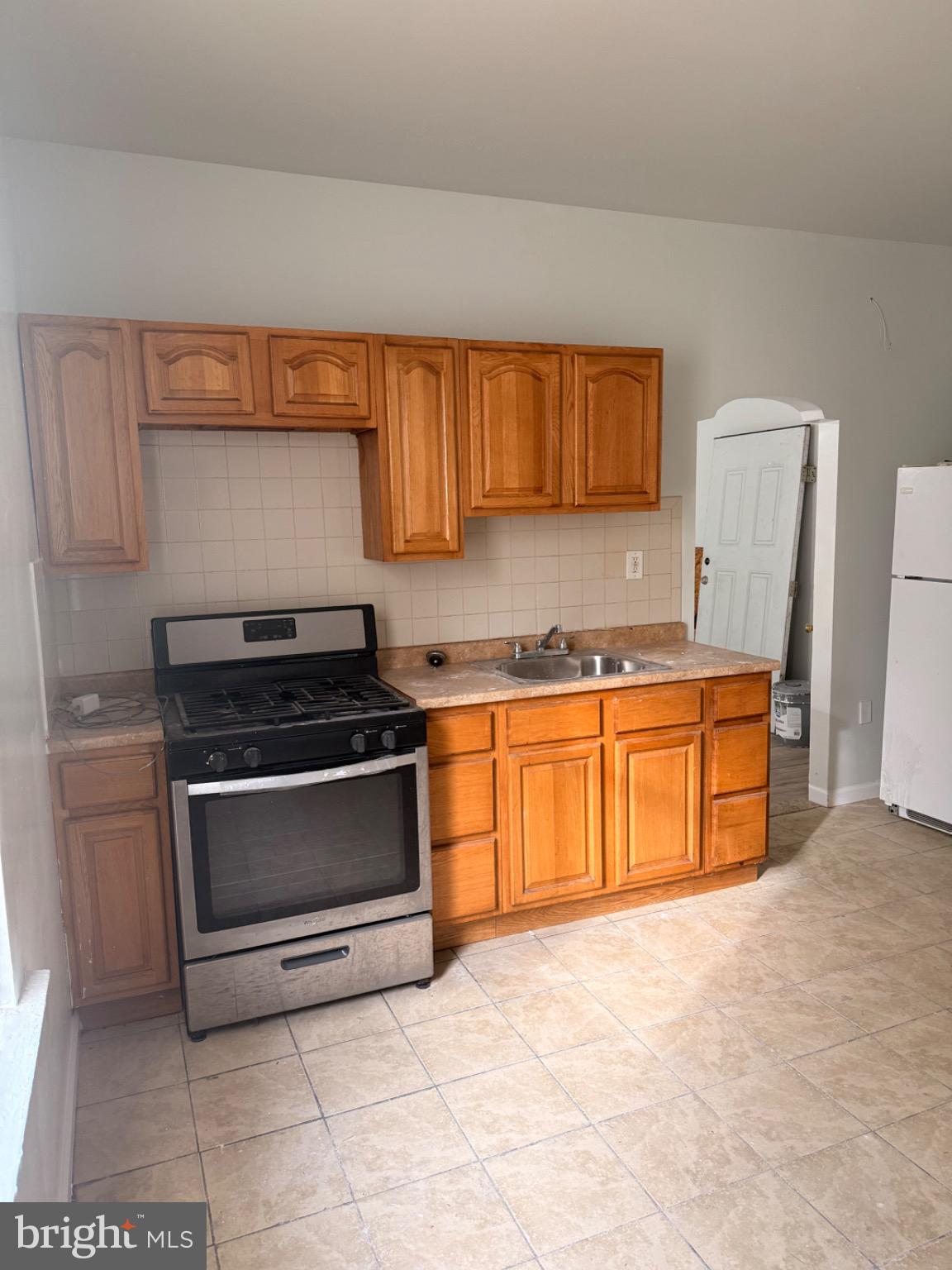4759 North Camac Street Philadelphia, PA 19141 - Photo 4 of 11 a kitchen with stainless steel appliances a stove a sink and a microwave