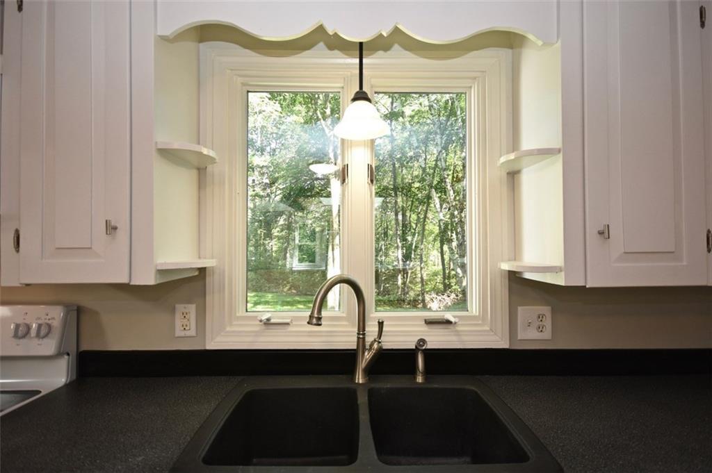 38 Skillin Road Cumberland, ME 04021 - Photo 5 of 17 The kitchen looks out to a grassy...
