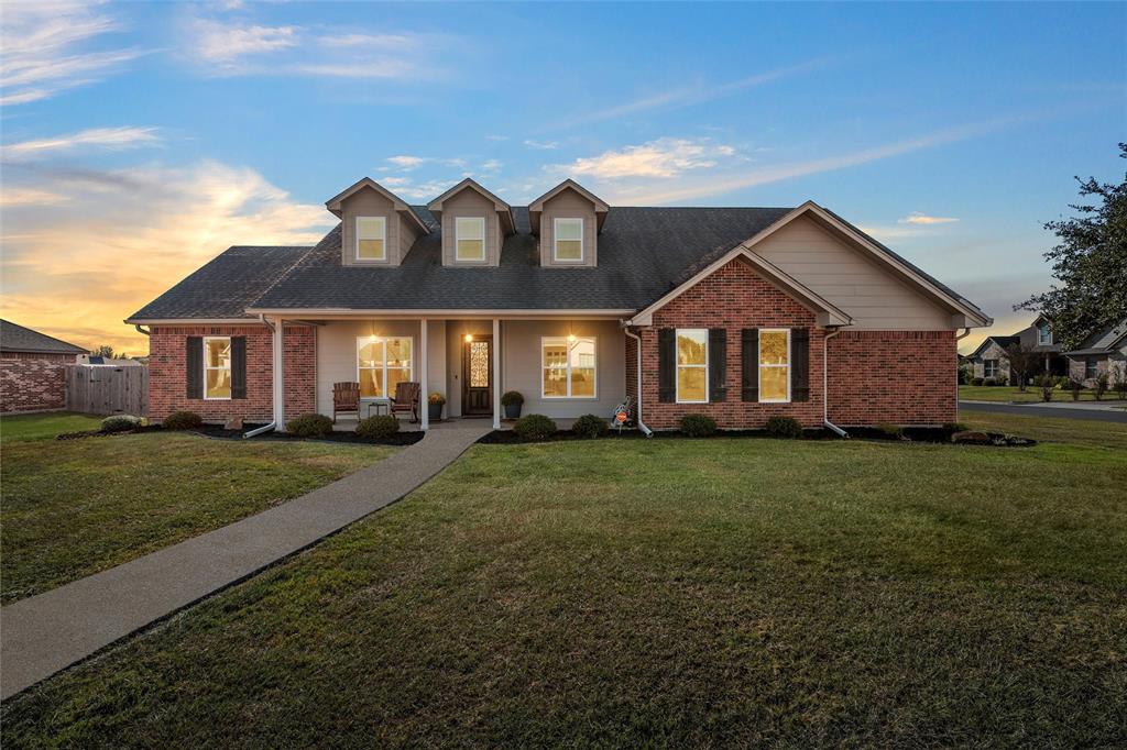 Traditional 2 story house with brick siding and a porch