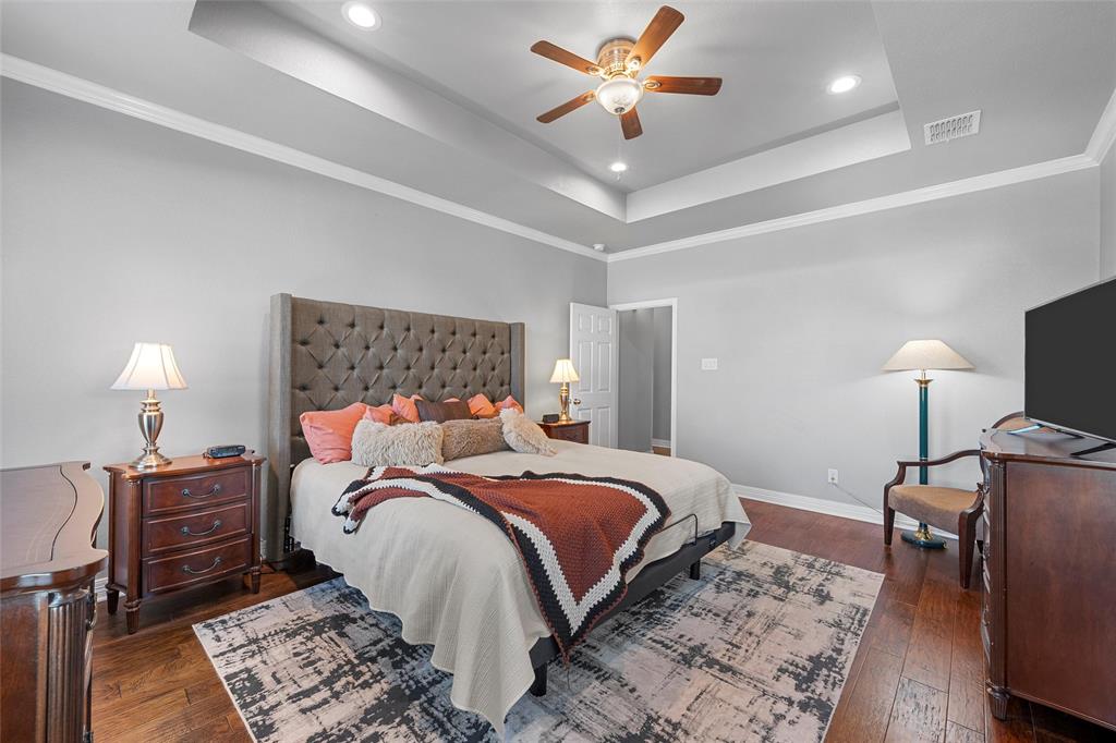 1420 Hoosier Park Robinson, TX 76706 - Photo 12 of 40 Primary Bedroom with a raised ceiling, hardwood flooring, ornamental molding, a ceiling fan, and recessed lighting