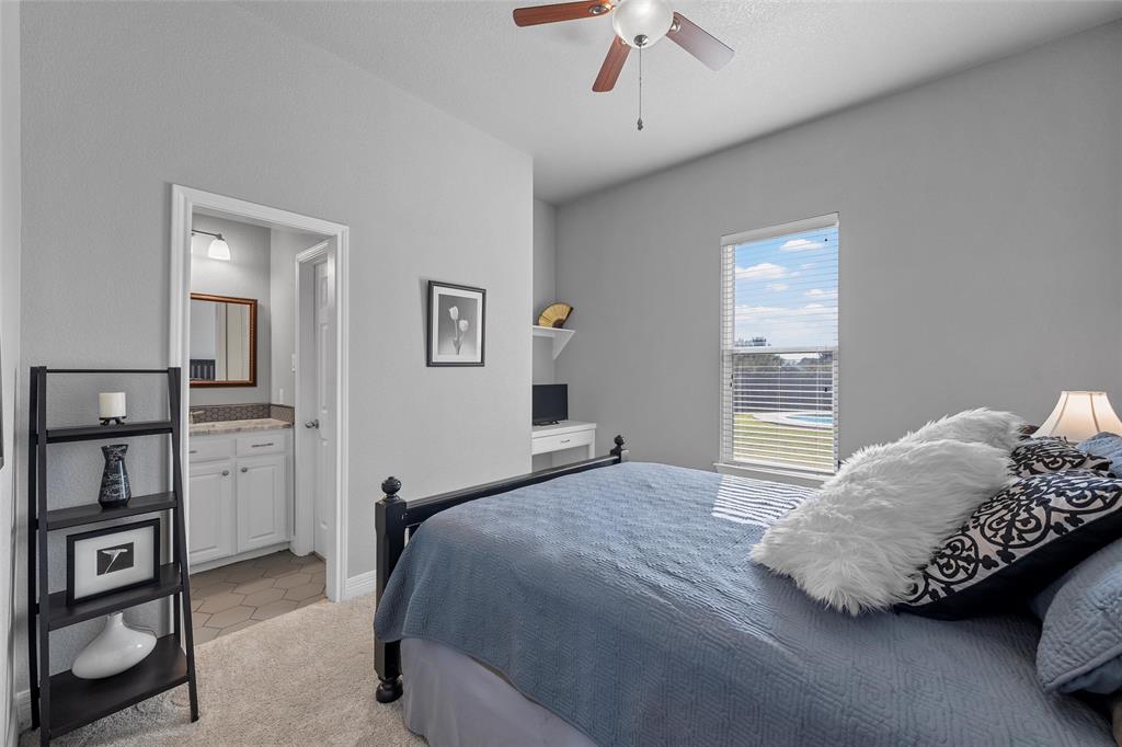 1420 Hoosier Park Robinson, TX 76706 - Photo 16 of 40 Bedroom featuring light colored carpet and a ceiling fan