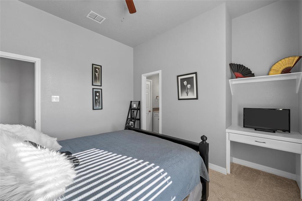 1420 Hoosier Park Robinson, TX 76706 - Photo 17 of 40 Bedroom with light colored carpet, ceiling fan, and ensuite bathroom