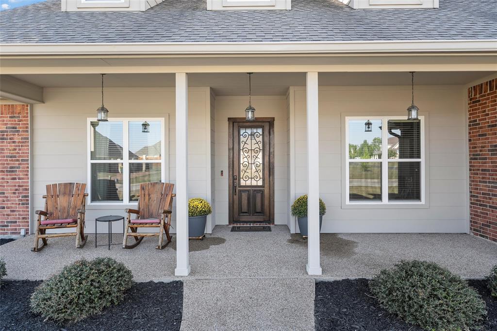 1420 Hoosier Park Robinson, TX 76706 - Photo 2 of 40 Property entrance featuring a porch, a shingled roof, and brick siding
