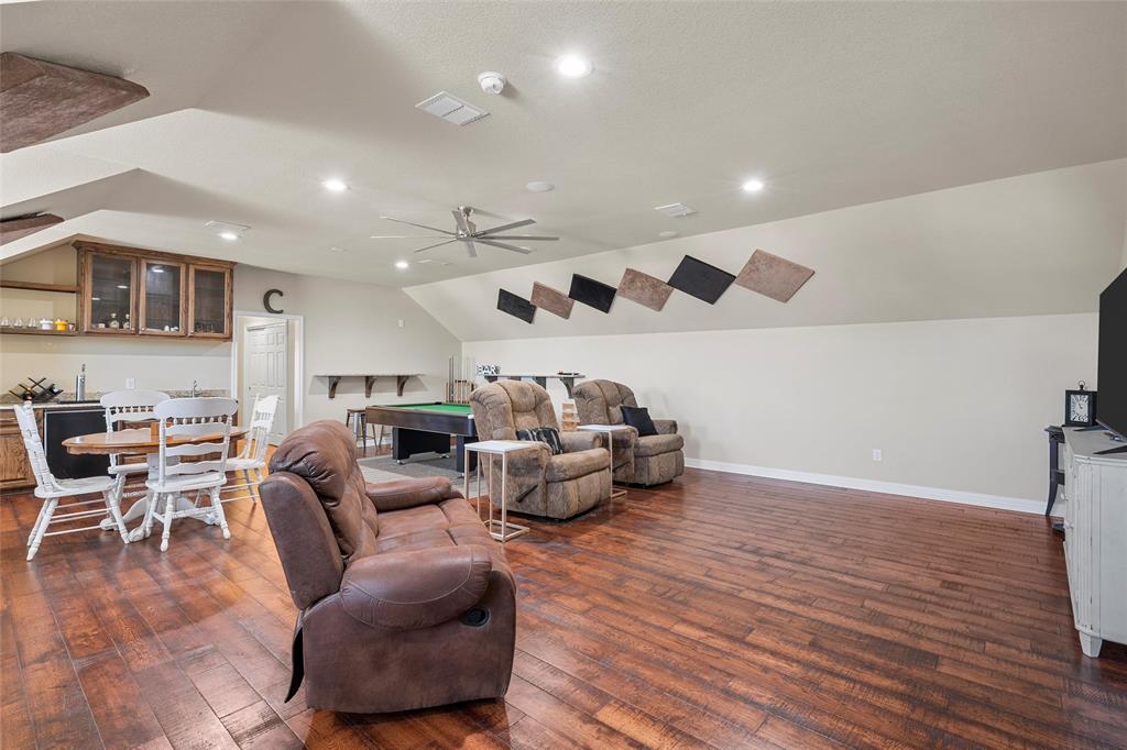 1420 Hoosier Park Robinson, TX 76706 - Photo 24 of 40 Upstairs Bonus Room/Second Living Area with hardwood floors, kitchenette and wet bar