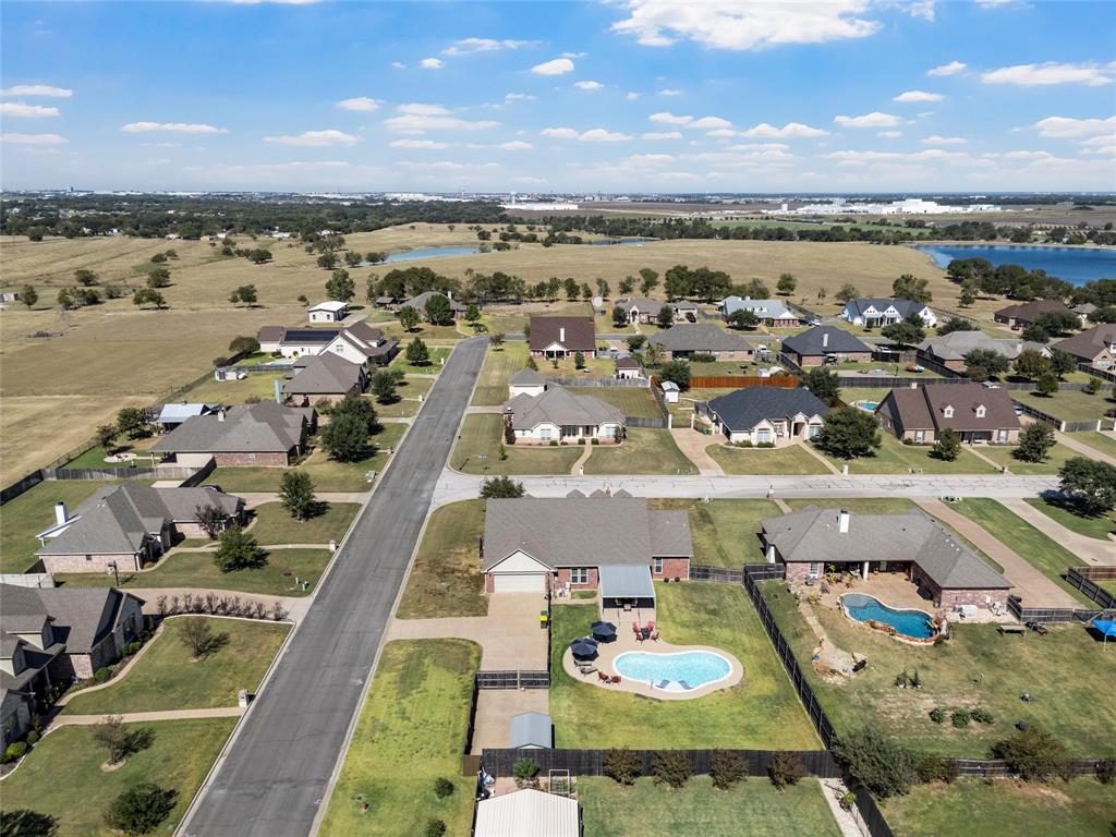 1420 Hoosier Park Robinson, TX 76706 - Photo 37 of 40 Aerial view of property and surrounding area featuring a large body of water and nearby suburban area