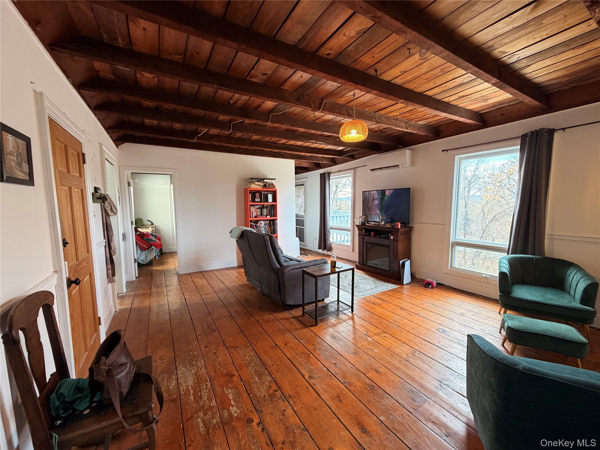 67 Old Albany Post Road, Unit 4 Rhinebeck, NY 12572 - Photo 1 of 7 a living room with furniture and a wooden floor