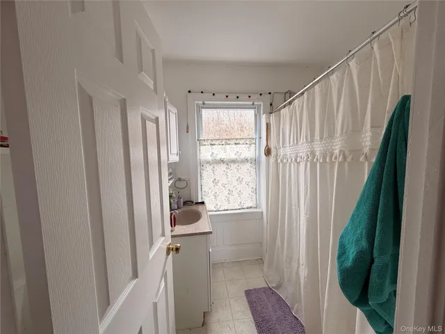 a bed room with a bed and a mirror