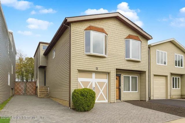 a front view of a house with a garage