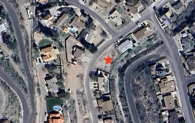 an aerial view of a building with a tree