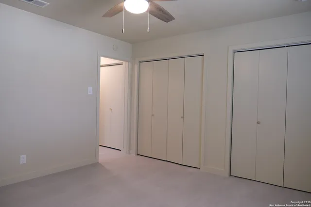 an empty room with fan