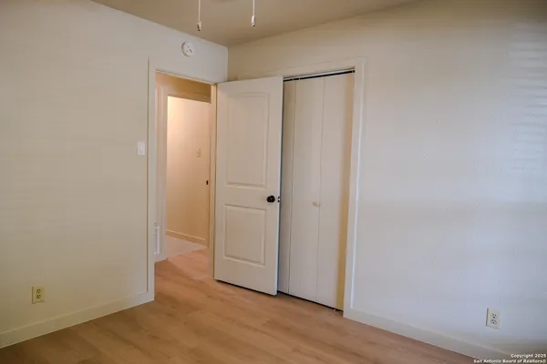 an empty room with wooden floor