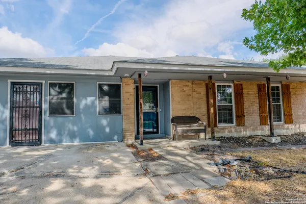 an entrance to house with yard