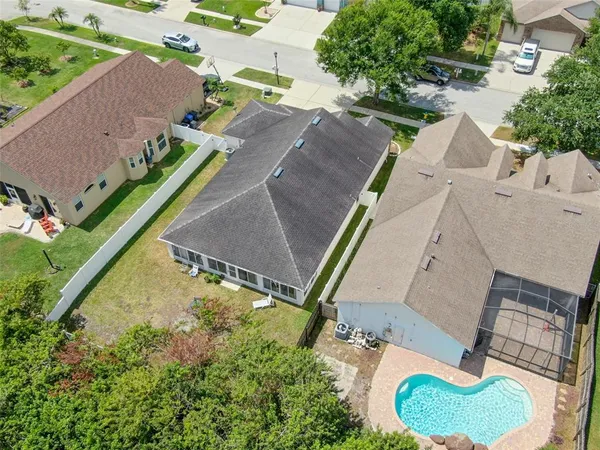 an aerial view of residential houses with outdoor space