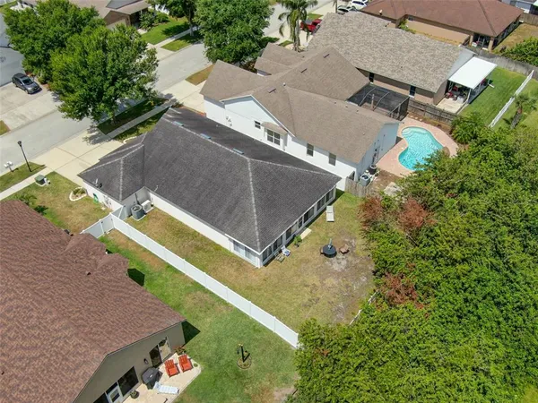 a view of a house with yard and a garden