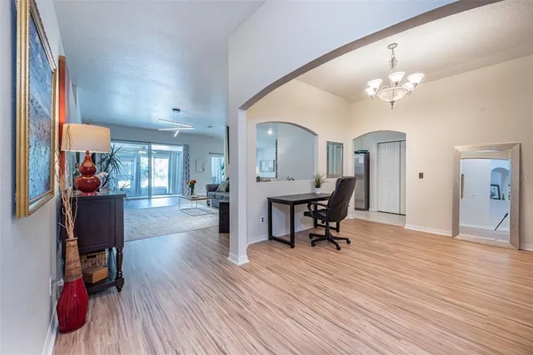 a view of a livingroom with workspace and a couch