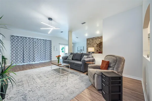 a living room with furniture and a table