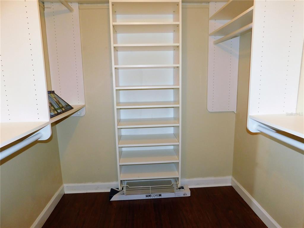 9353 Vía Segovia New Port Richey, FL 34655 - Photo 16 of 25 a view of walk in closet with empty racks