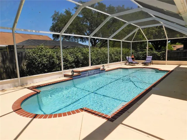 a view of a swimming pool with a porch