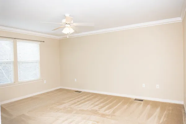 a view of an empty room with a window