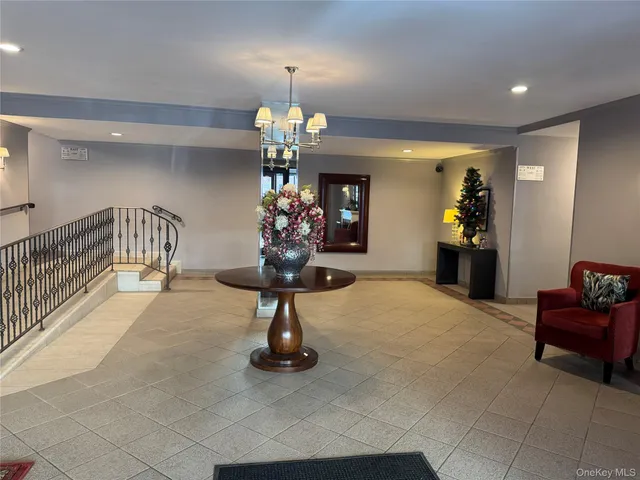 a view of a lobby with furniture and chandelier