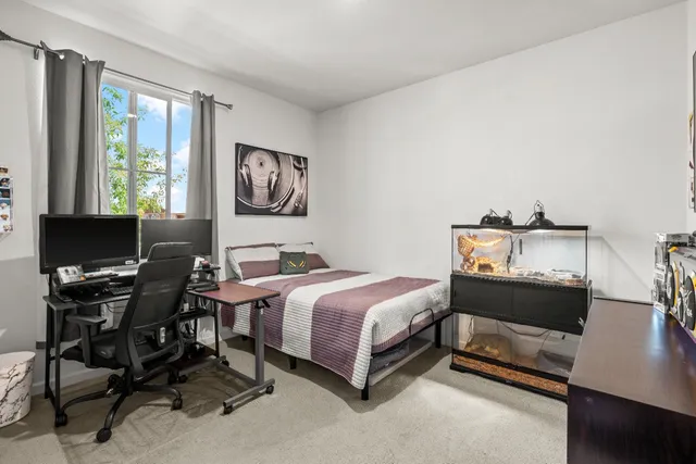 a bedroom with a bed and furniture