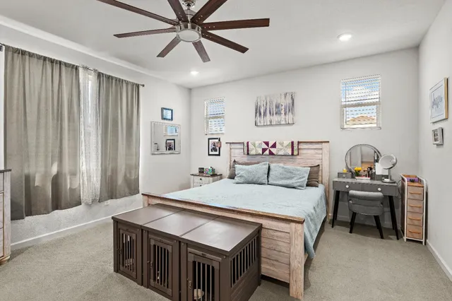 a spacious bathroom with a double vanity sink a mirror and a bathtub