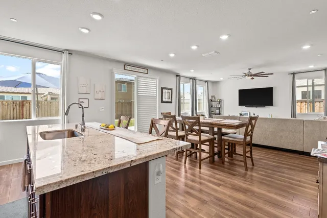 a kitchen with a stove a sink and a refrigerator