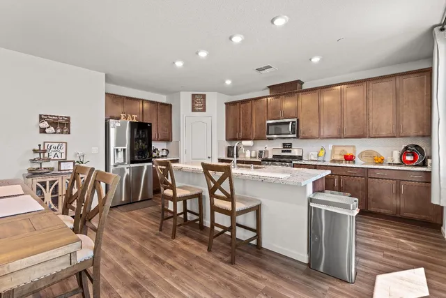 a kitchen with a table and chairs in it