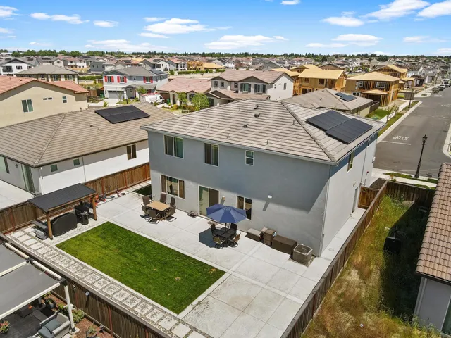 a view of a terrace with chairs and a table