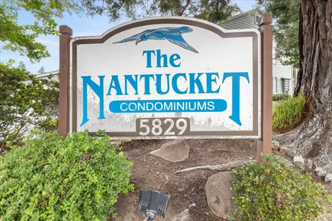 a view of outdoor space with signage and flags