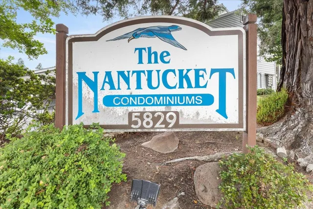 a view of outdoor space with signage and flags