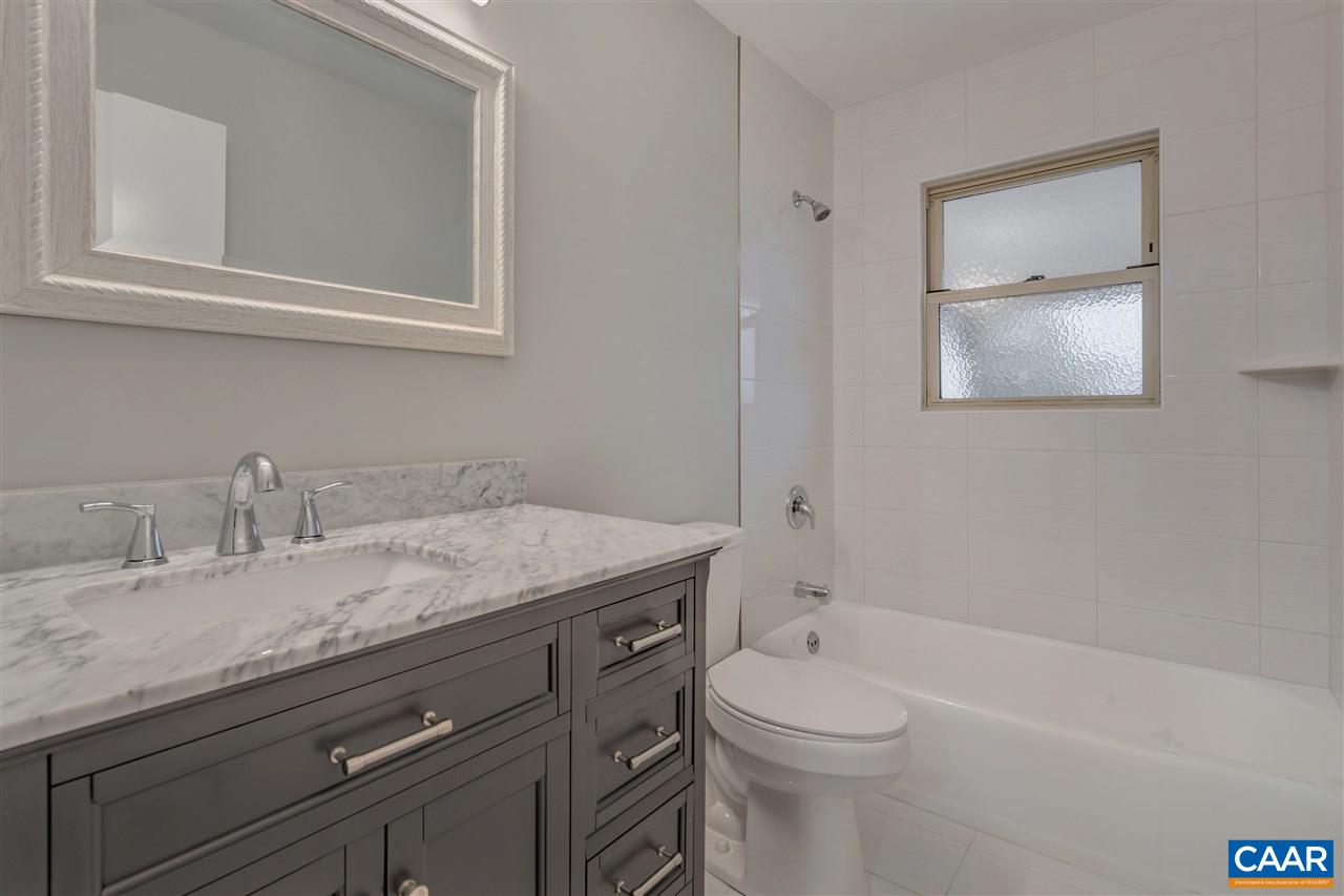 520 Stephens Loop Ruckersville, VA 22968 - Photo 16 of 33 a bathroom with a granite countertop sink a toilet and bathtub