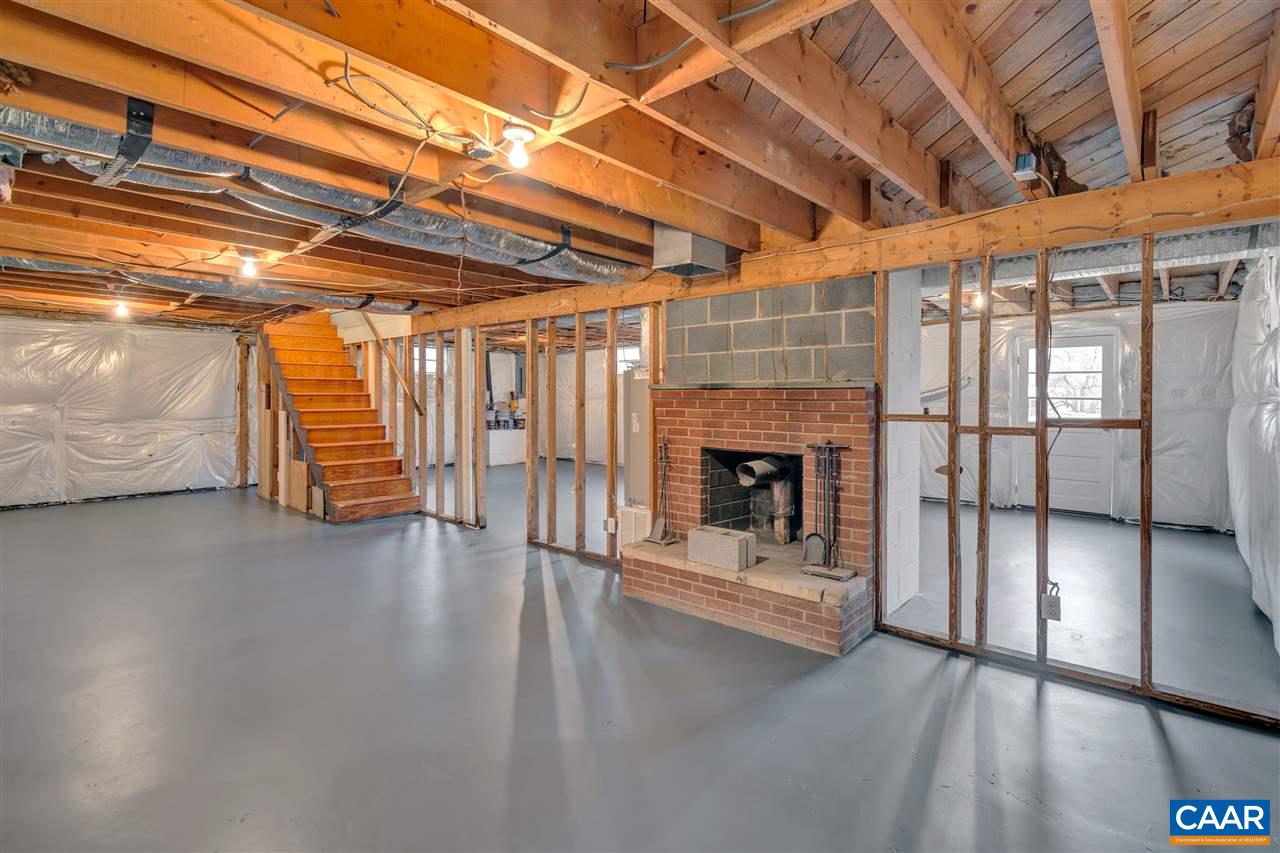 520 Stephens Loop Ruckersville, VA 22968 - Photo 21 of 33 a view of an empty room with a fireplace and a window